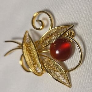 Elegant Gold and Red Brooch